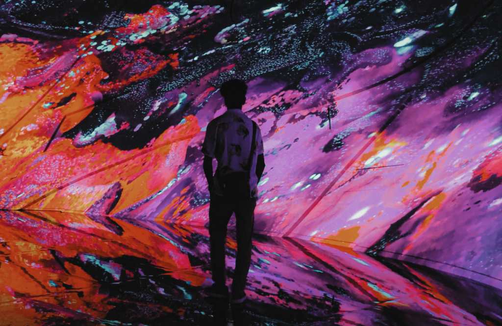 Man stood in an art installation.