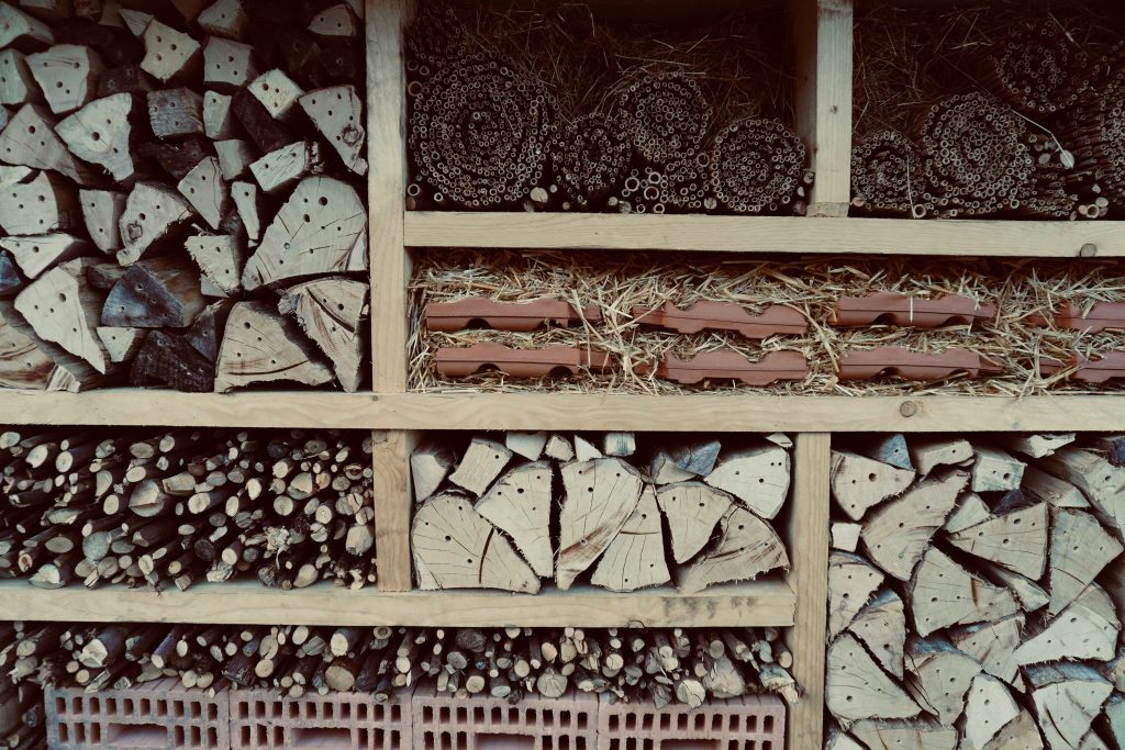 Bee or Bug Hotel.. bamboo and other wood and sticks of various diameters stacked into different segments.