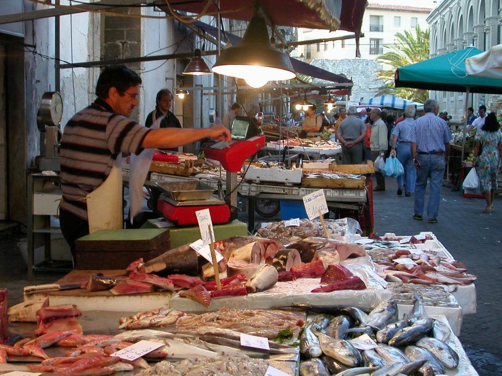 Market stalls with locally caught seafood in Siracuse, Italy